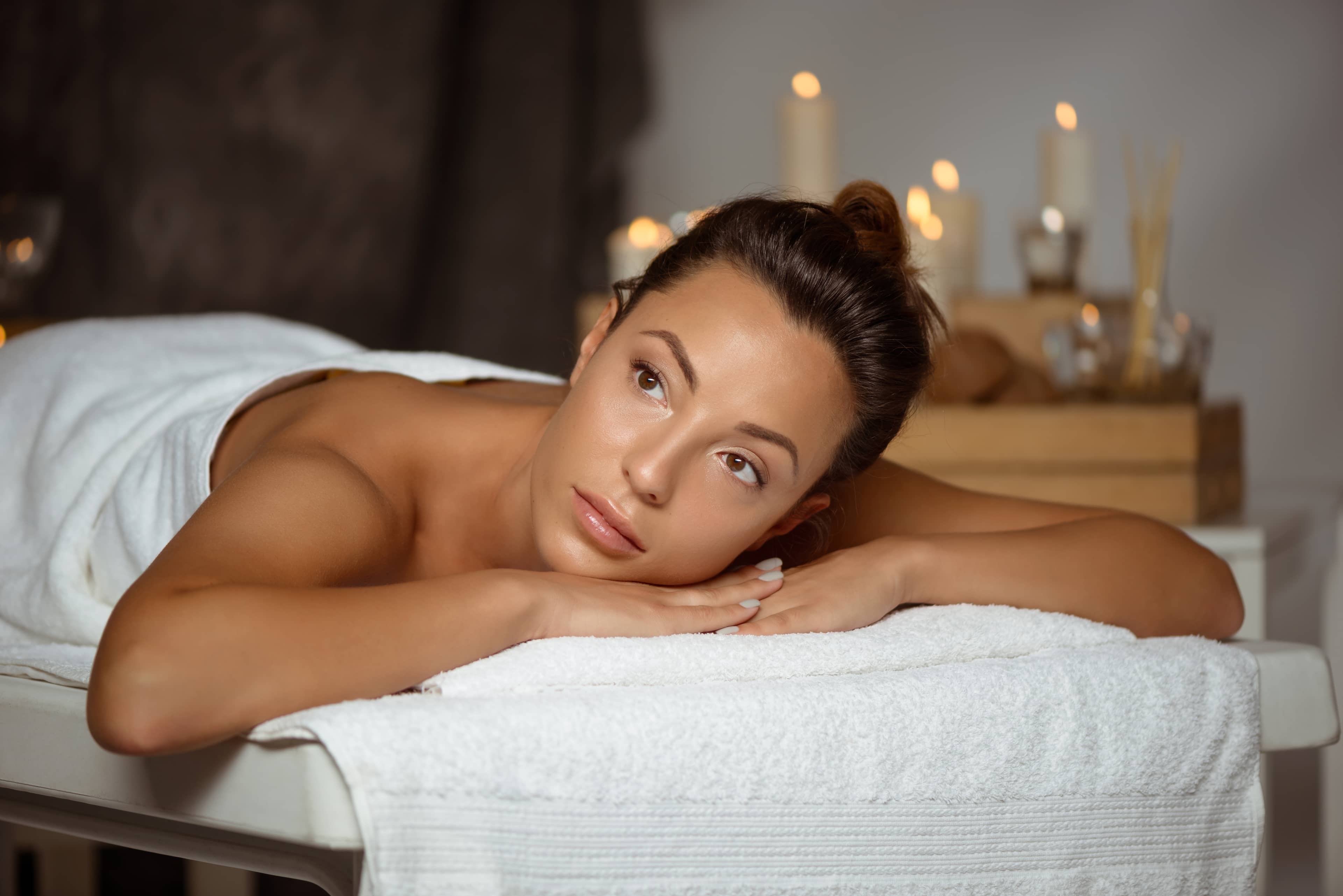 Woman relaxing in a massage treatment room